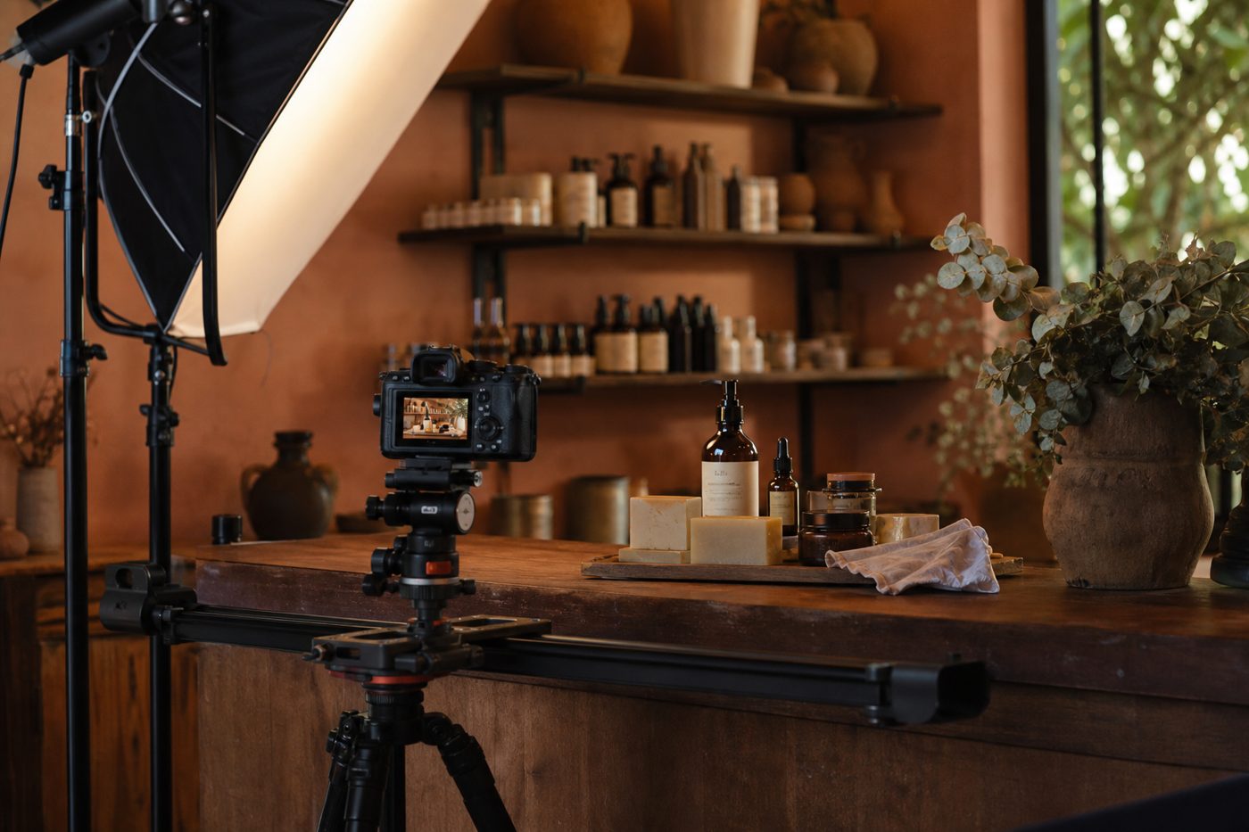 Commercial video setup filming products on a wooden counter